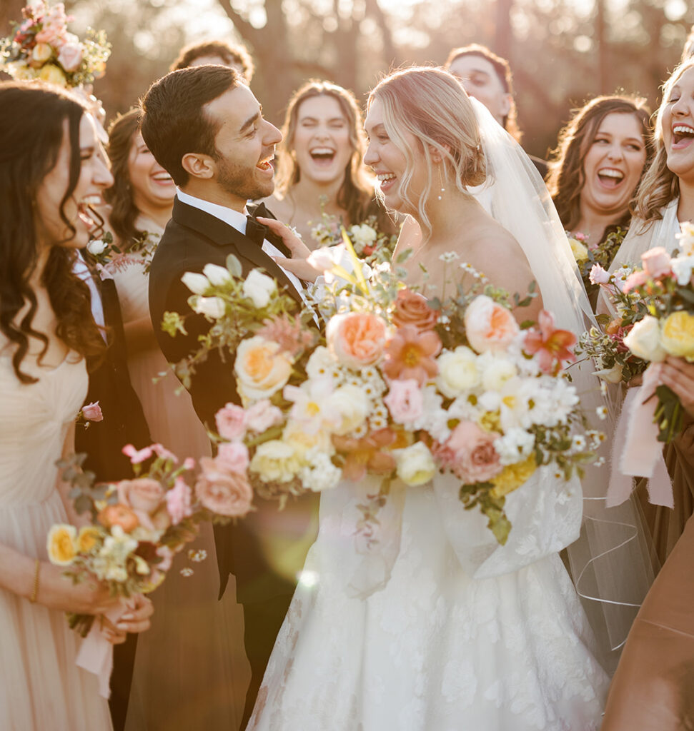 A sweet newly married couple in Austin, TX surrounded by their bridal party on their wedding day!