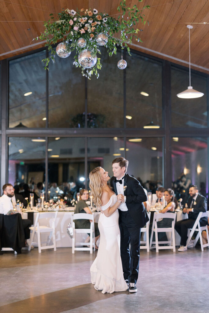 A wedding couple dancing in Austin, TX at the Grand Lady venue.  Wedding Planning courtesy of Moments by Maddie.