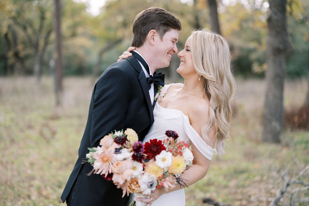 A cute couple in Texas after just getting married, wedding planning by Moments by Maddie!