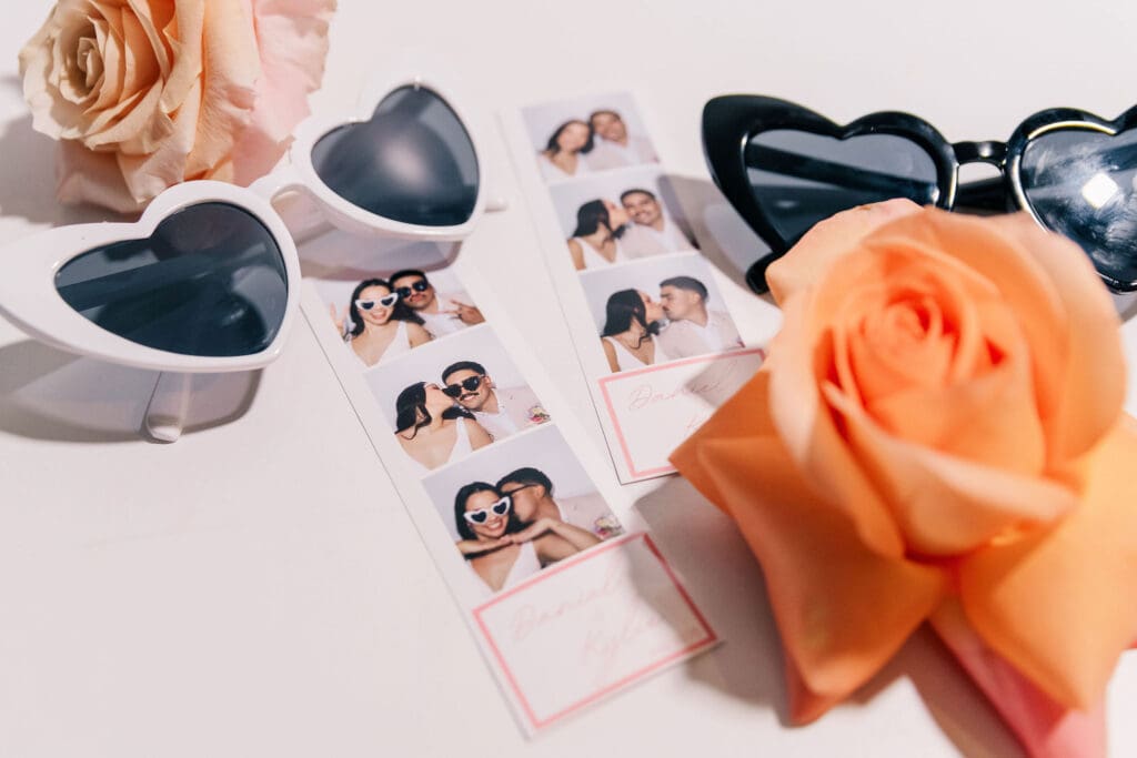 Photo strips with fun heart-shaped glasses from Maddie’s modern wedding photo booth—an easy way to entertain guests.