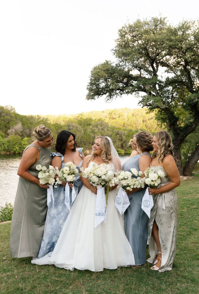 Bridal party with white floral bouquets in the Texas hill country