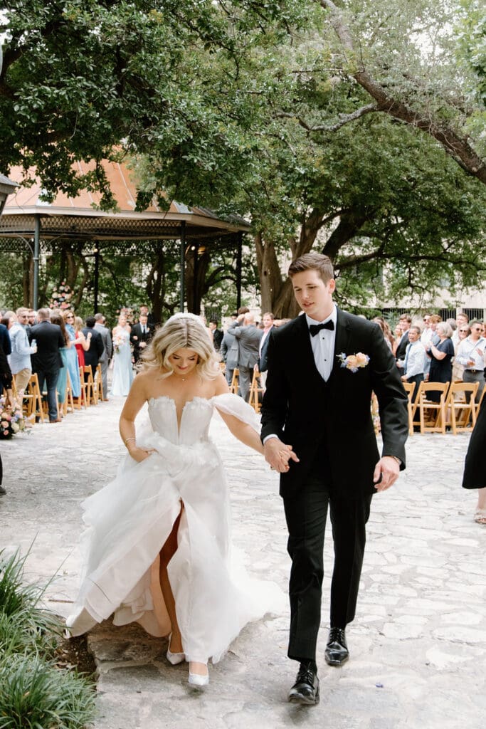 walking down the aisle towards their thankful wedding planners