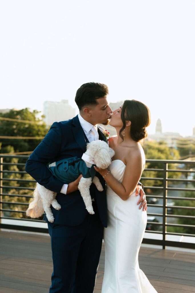 bride and groom with their pup