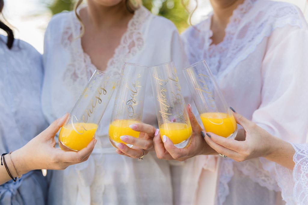 Bridal party sharing mimosas before wedding day