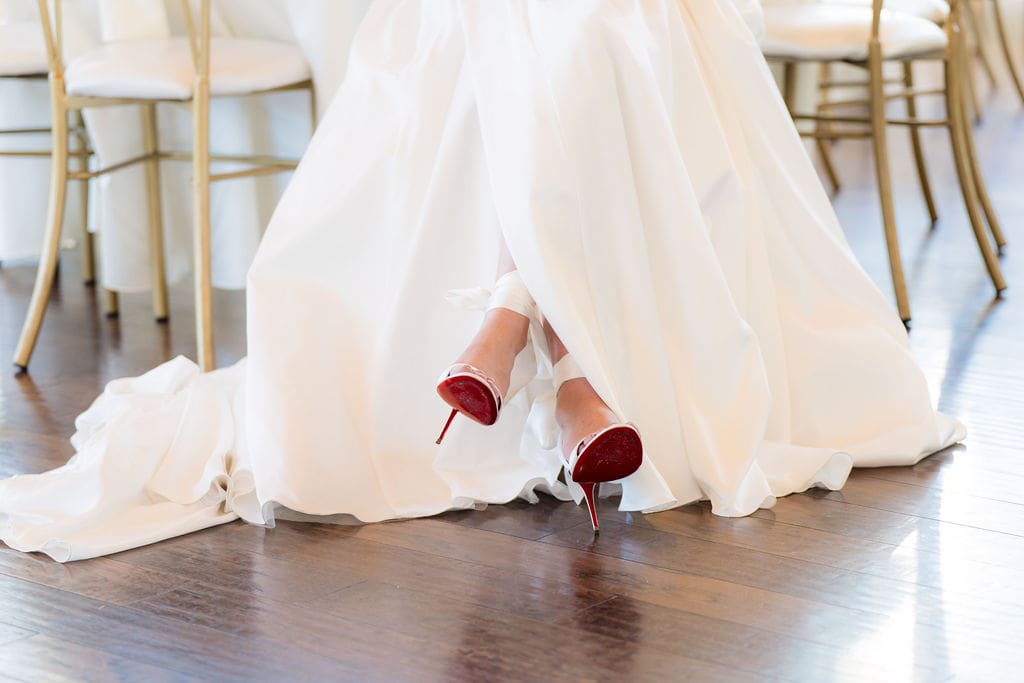 Detailed shot of bridal shoes and dress