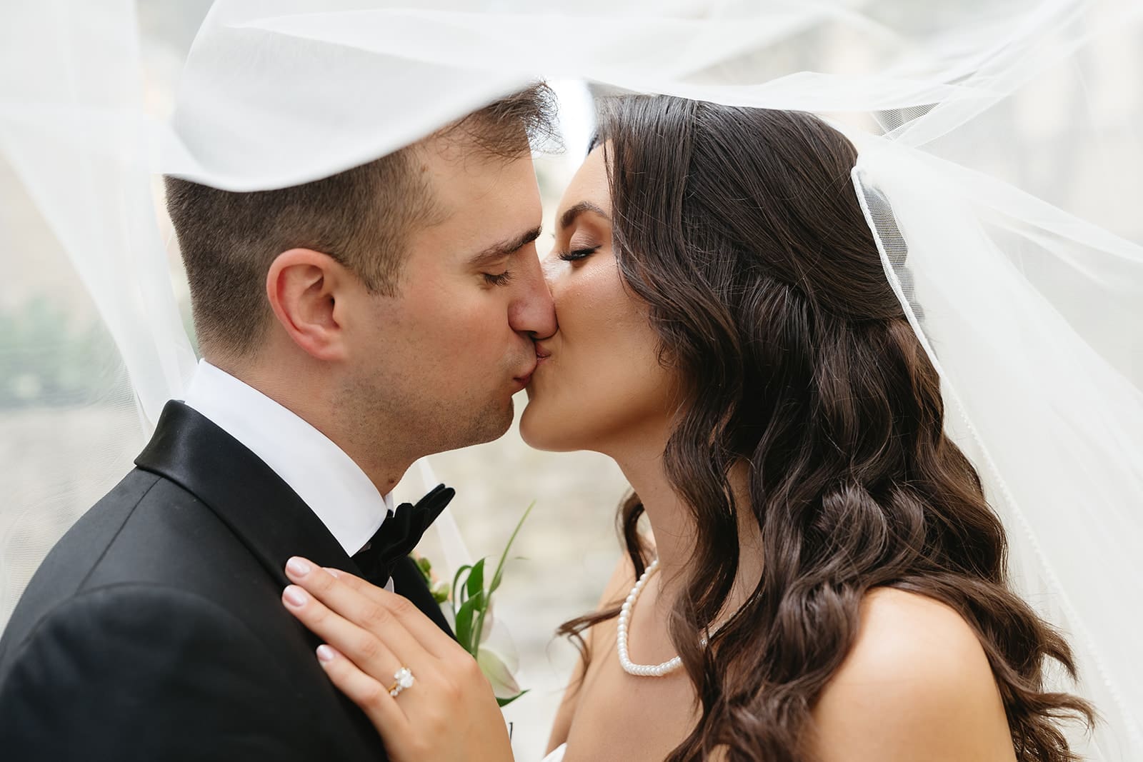 Close up of newlyweds sharing a kiss